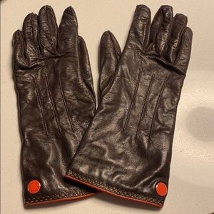 brown leather coach gloves with orange stitching